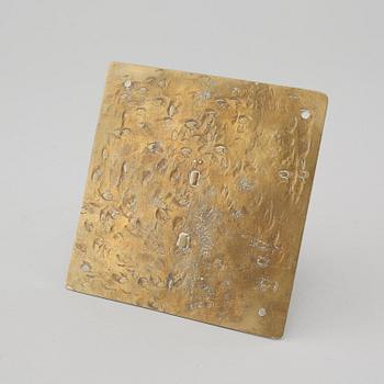 A brass sundial dated 1715.