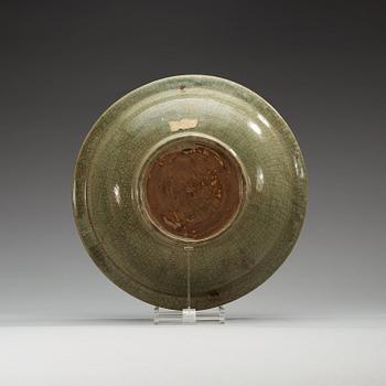 A large celadon charger, presumably southeast asia, 17th Century.