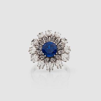 901. A untreated sapphire, 1.75 cts, and navette-cut diamond, 4.10 cts ring.