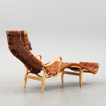 A 'Pernilla 3' lounge chair by Bruno Mathsson for Firma Karl Mathsson, dated 1973.