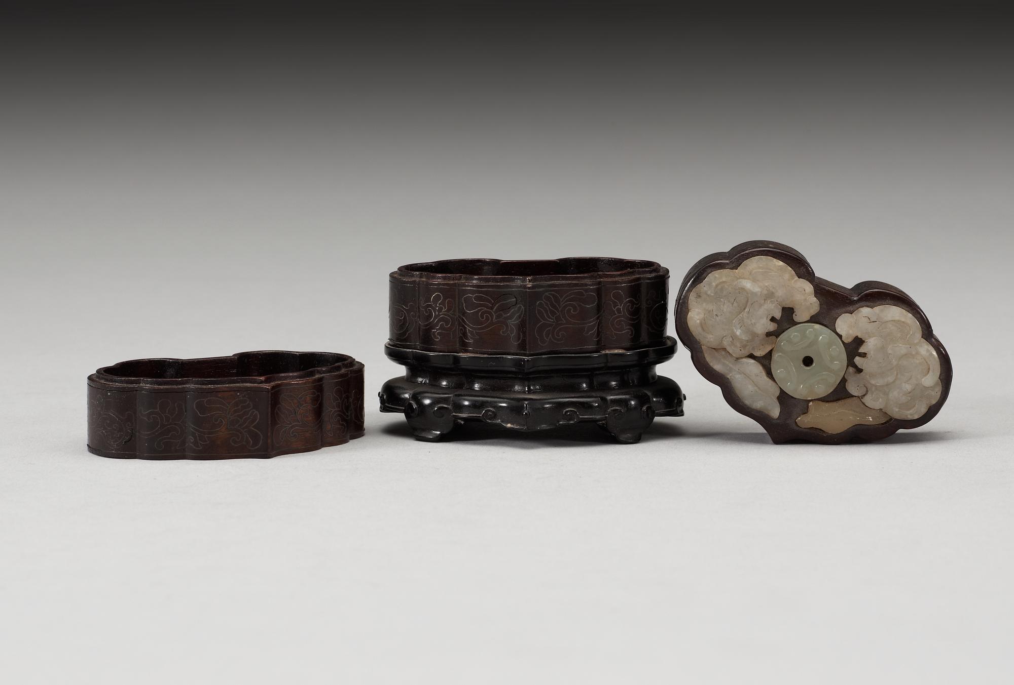 A three tiered wooden silver-inlayed box with cover, Qing dynasty.