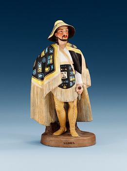 1338. A Russian bisquit figure of a Kolosh man, Gardner manufactory, late 19th Century.