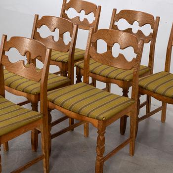 A set of six Danish Henning Kjaerulf chairs, second half of 20th century.