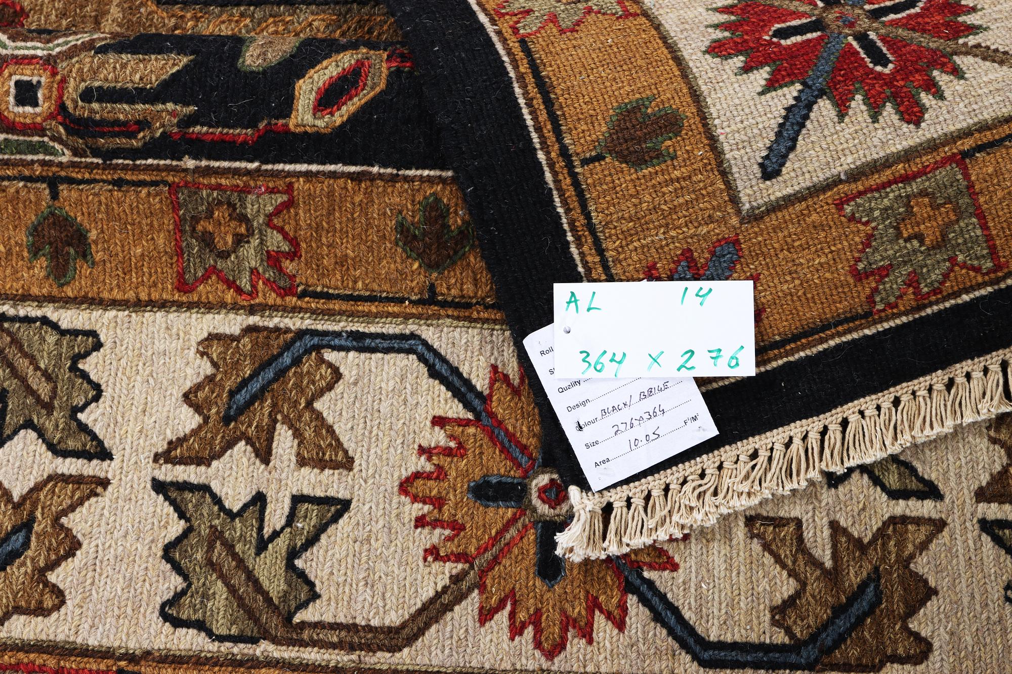 An oriental carpet with Mamluk design, c. 364 x 276 cm.