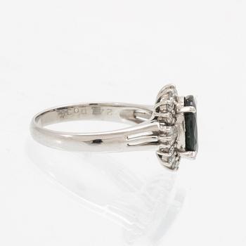 Ring, Platinum 850 with brilliant and tapered baguette cut diamonds and an oval faceted sapphire.