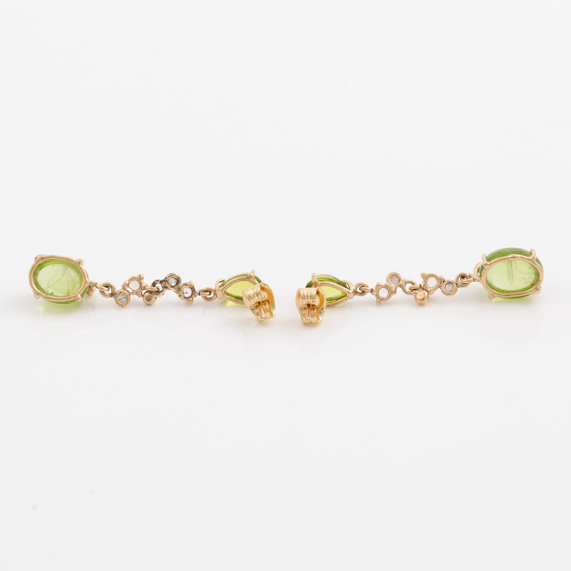 Earrings, Mandelstam, 18K gold set with cabochon-cut peridots, tourmalines, and brilliant-cut diamonds.