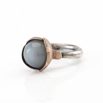 Ole Lynggaard, ring "Lotus" silver, white gold and cabochon-cut moonstone, design Charlotte Lynggaard.