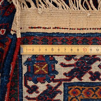An oriental carpet, c. 360 x 270 cm.