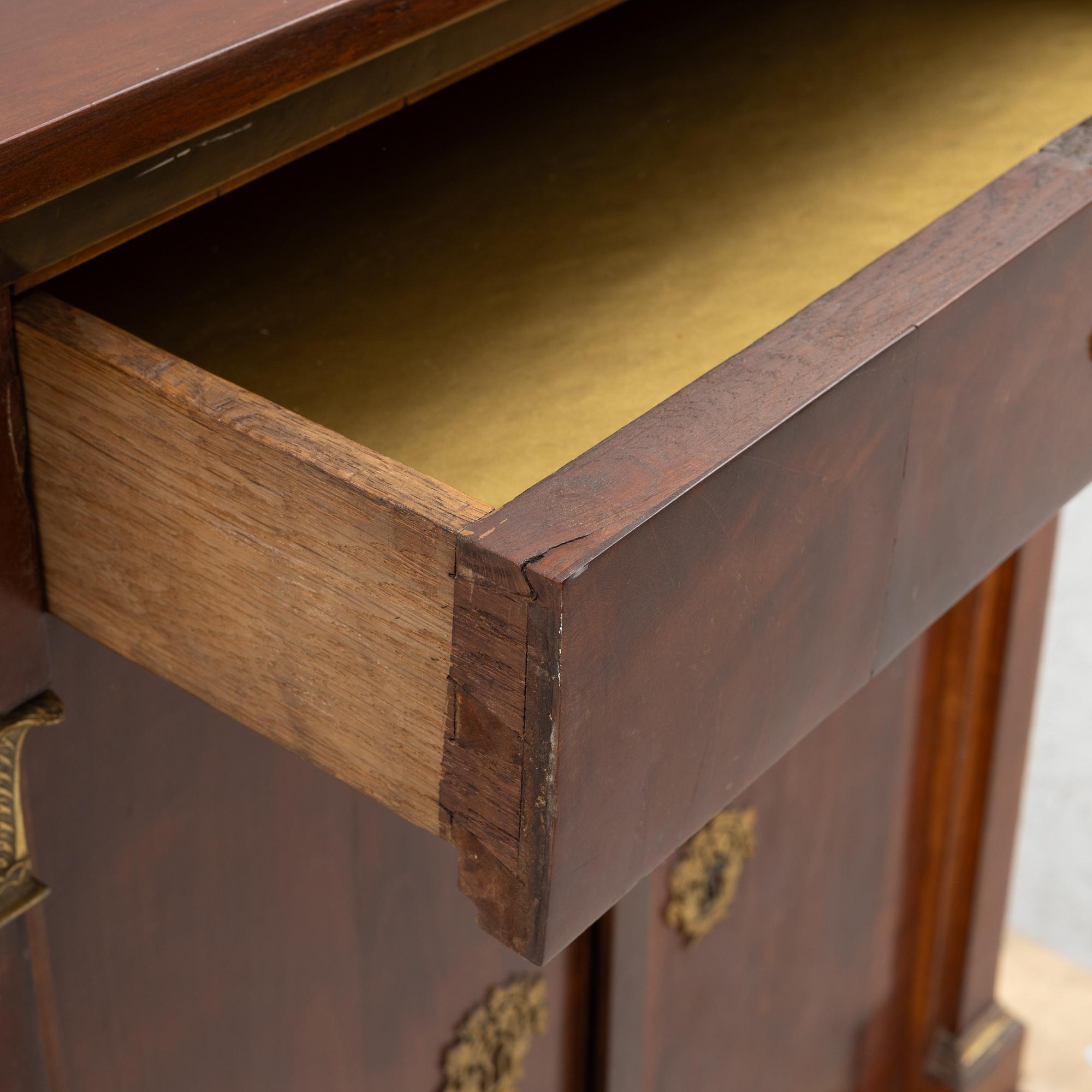 An Empire cabinet, first half of the 20th Century.