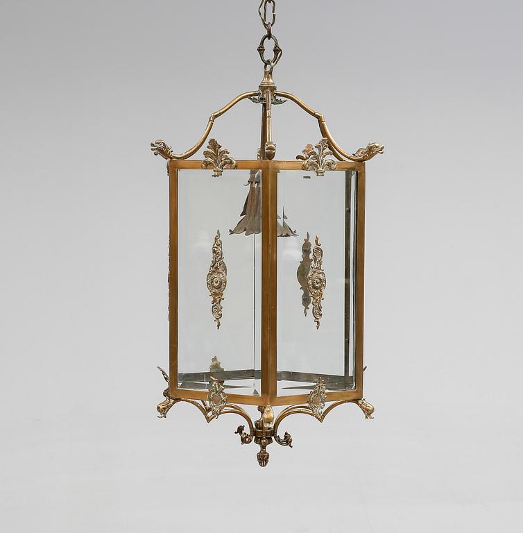 TAKLYKTA, mässing, 1900-talets första hälft. Höjd ca 70 cm.