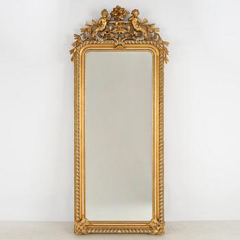 A Rococo revival mirror, late 19th Century.