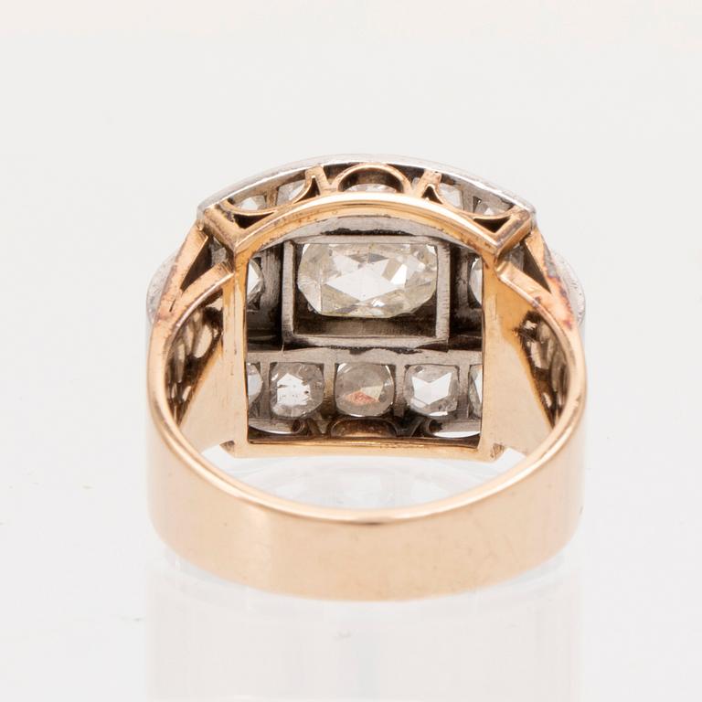 An 18K white and red gold ring set with rose cut diamonds.