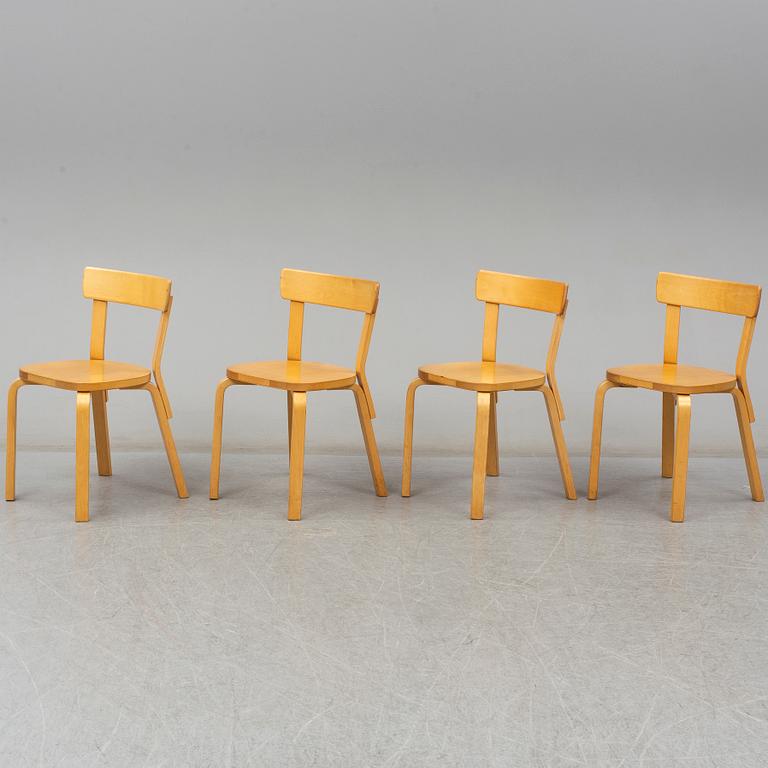 ALVAR AALTO, a table with four model 69 chairs, Artek.