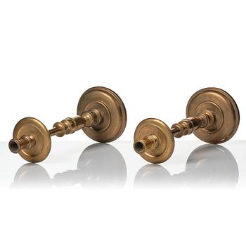 A pair of baroque brass candlesticks, 18th century.