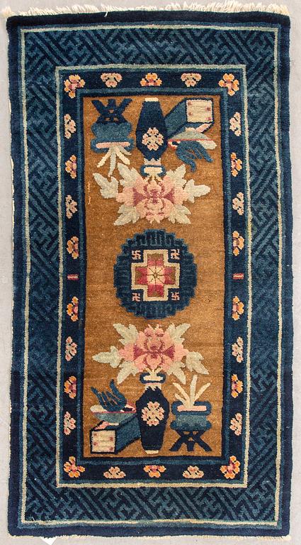 A semiantique Chinese Baotou carpet ca 130x69 cm.