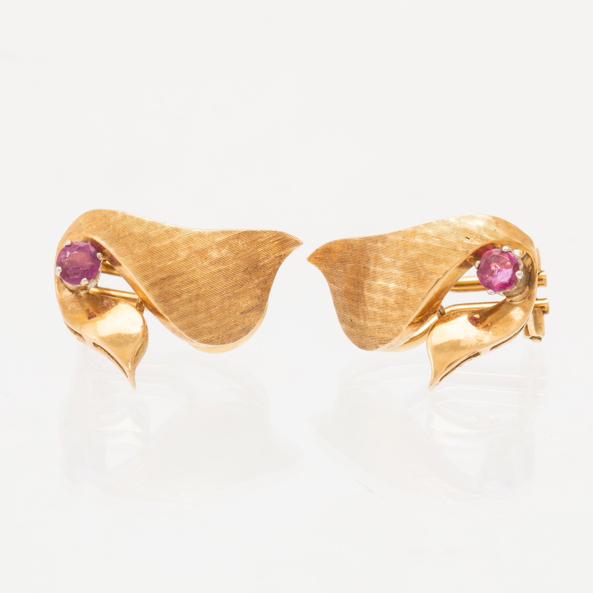 A pair of 18K gold earrings.