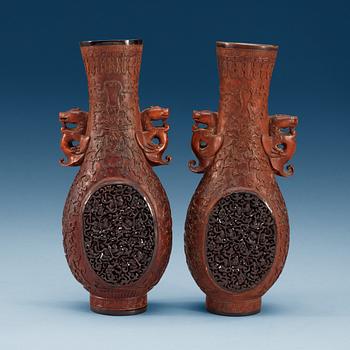 A pair of carved wooden and tortoise shell inlayed vases, presumably late Qing dynasty (1644-1912).