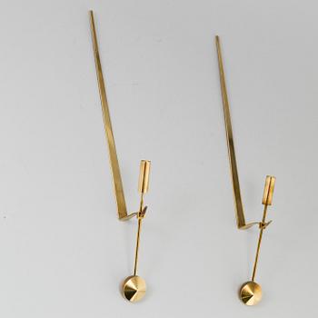 A pair of brass wall candle holders by Pierre Forsell, Skultuna.