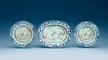 A famille rose serving dish and two dinner plates, Qing dynasty, Qianlong (1736-95).