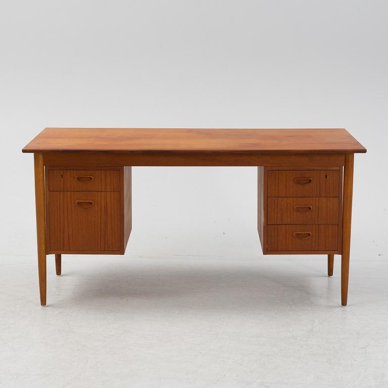 A teak veneered desk, 1950's/1960's.