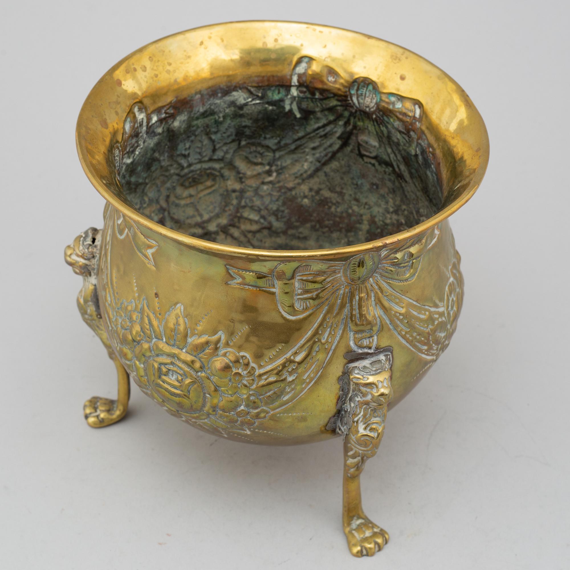 An 18th century brass flower pot.
