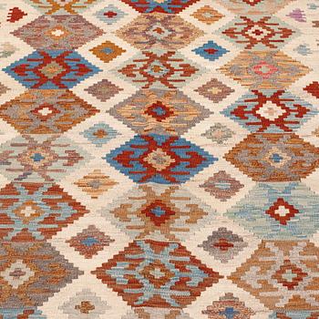 An oriental kilim, around 232 x 170 cm.