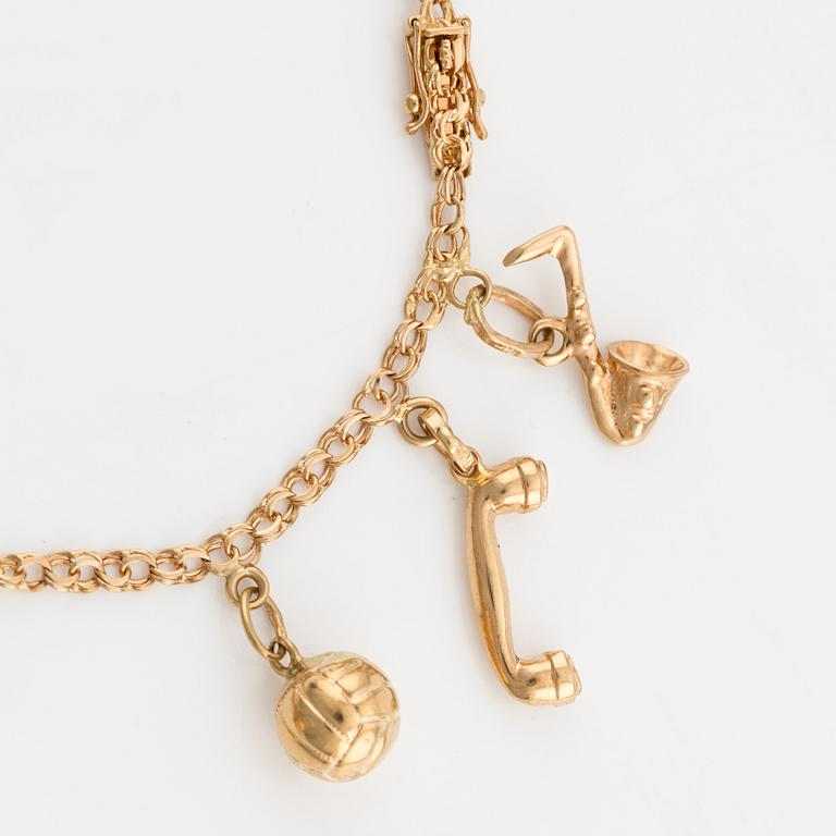 Bracelet, 18K gold with charms.