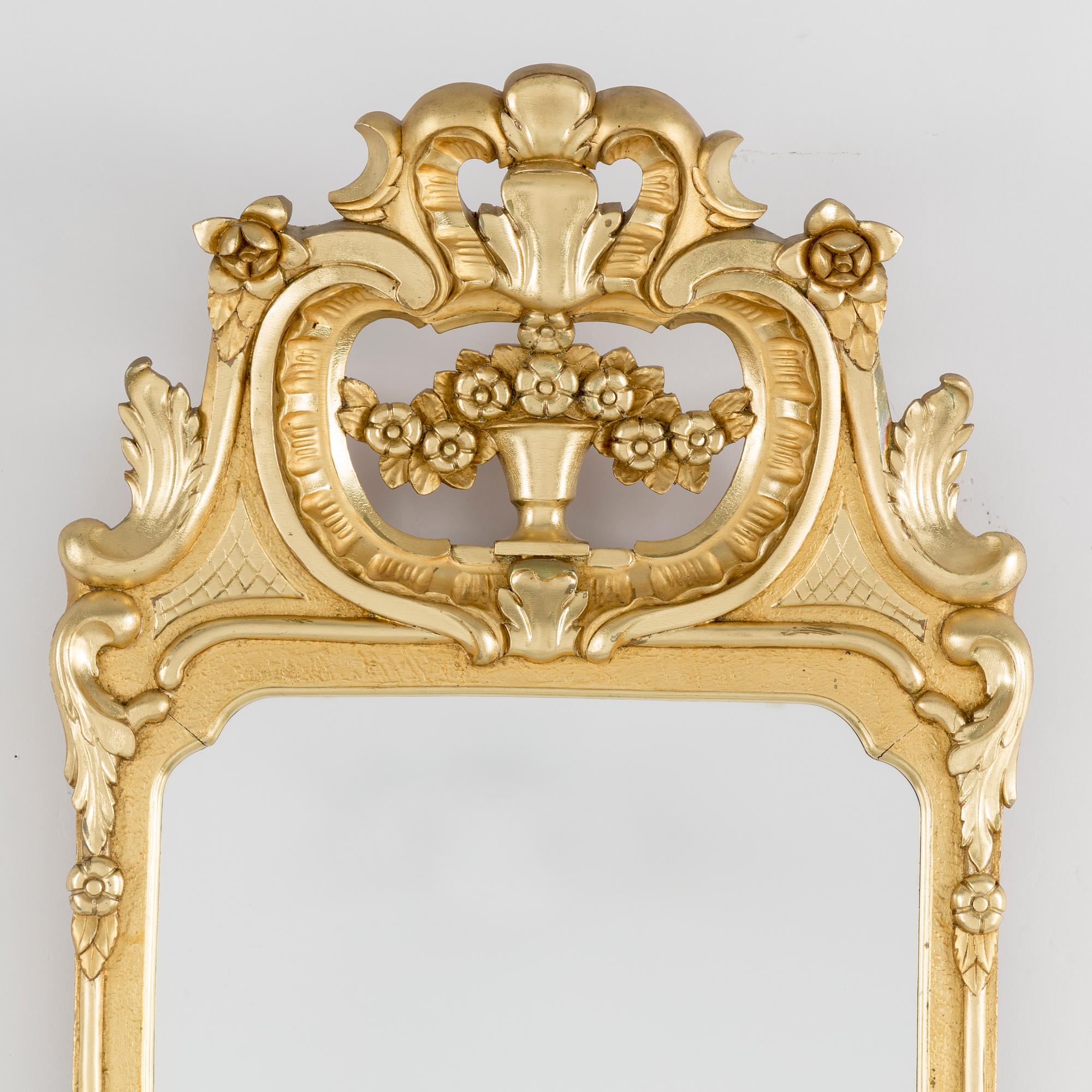 A mid 20th century rococo style mirror.