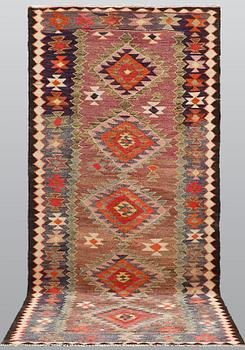 A Kelim rug, c. 253 x 120 cm.