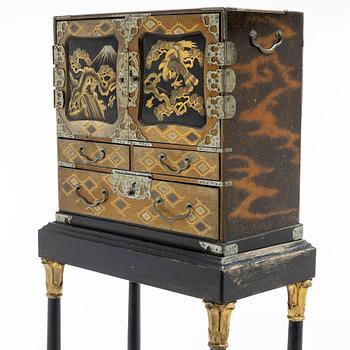 A maki-e cabinet on stand, Japan, 19th century.