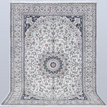 A Nain carpet, part silk, so called 6LAA, approximately 279 x 200 cm.