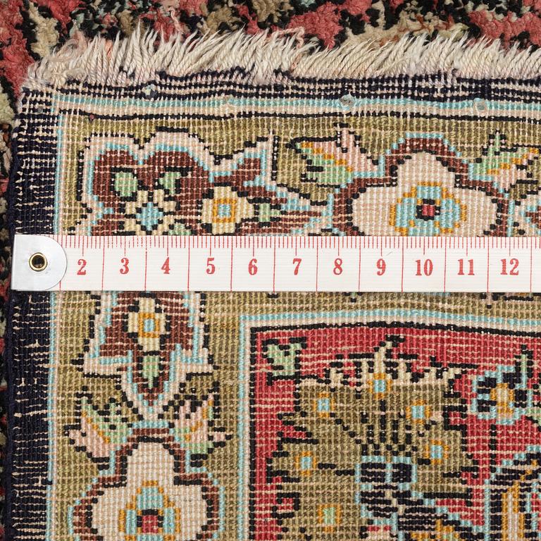 A semi-antique silk Quum, c. 216 x 141 cm.