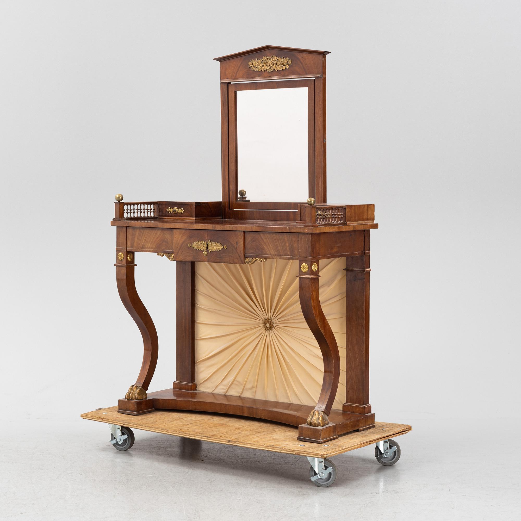An Empire style dressing table by Johan Öman, Stockholm (1815-33), dated 1827.