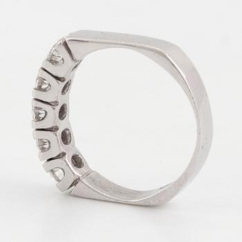 A half-eternity 18K white gold diamond ring.