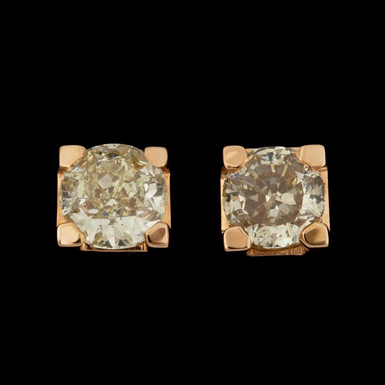 A pair of Fancy Brownish Greenish Yellow diamond earrings. 1.14 and 1.25 cts.
