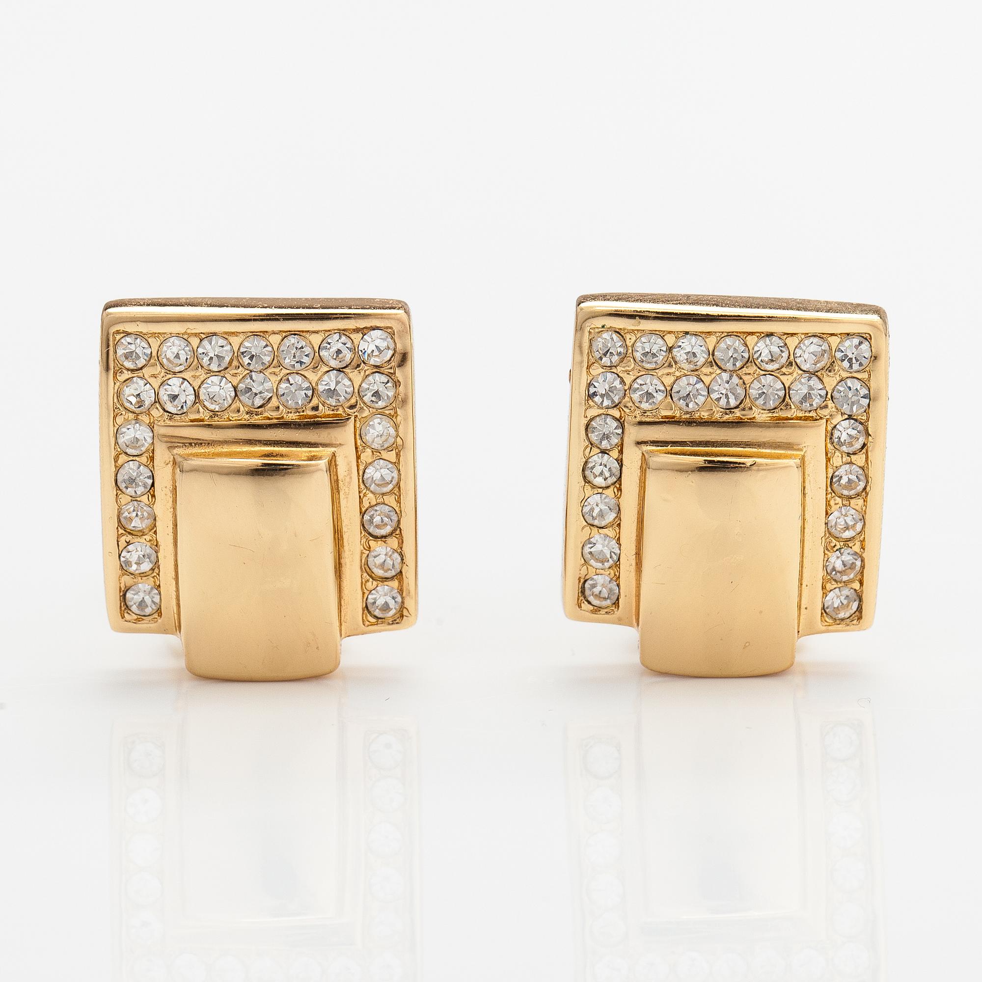 Christian Dior, A pair of gold coloured metal earrings with rhinestones. Marked Chr. Dior, Germany.
