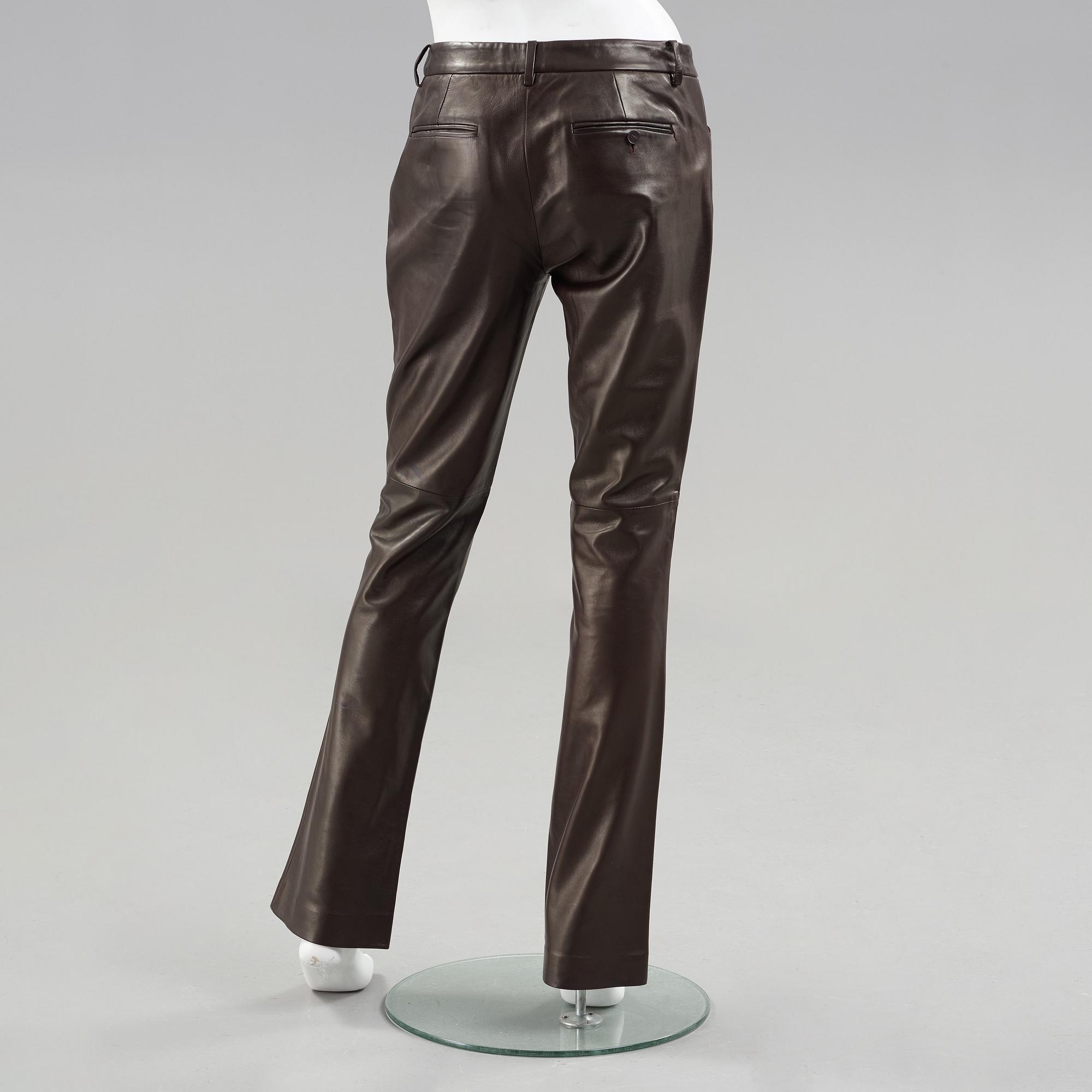 Apair of dark brown leather pants by ralph lauren.