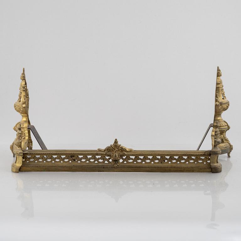 A pair of Louis XVI-style bronze andirons, France, later part of the 19th century.