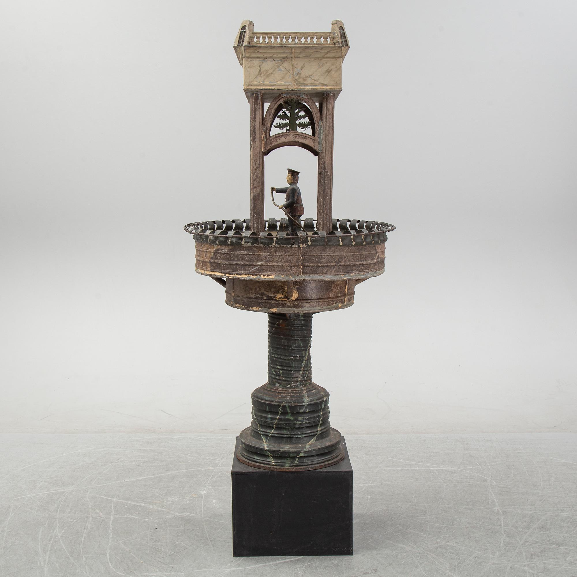 A painted and richly decorated plate garden fountain, late 19th century.