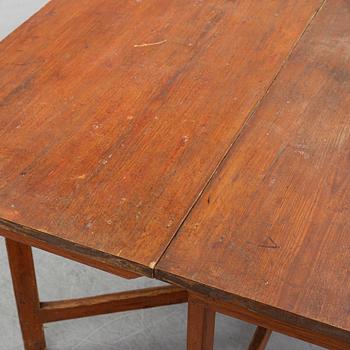 A pine gate leg table, 19th Century.
