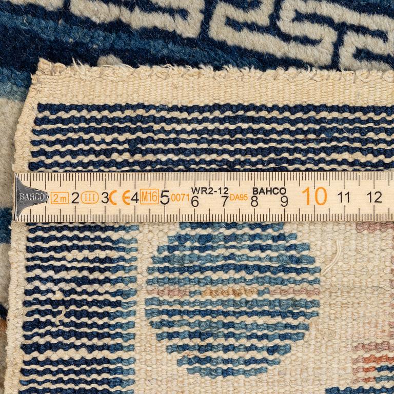 A pair of Baotou rugs, China, c. 120 x 64 cm.