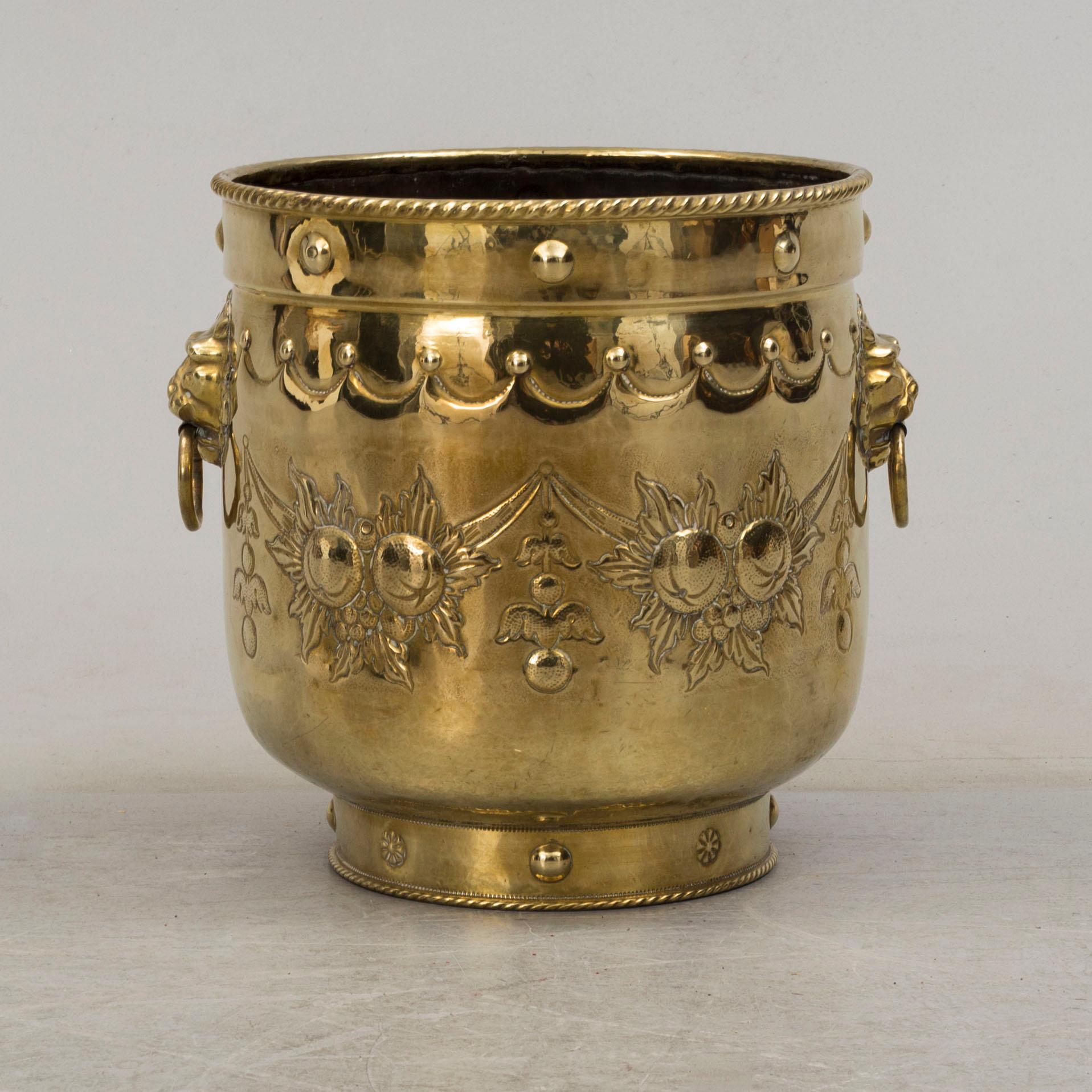 An 18th century brass flower pot.