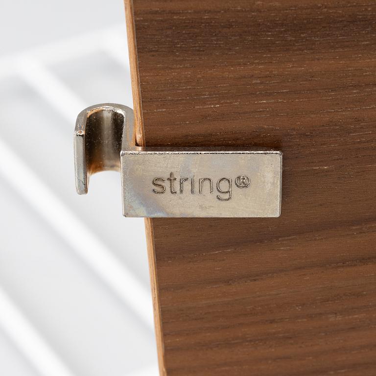 Nils Strinning, a "String" book case with cabinet, Sweden, 21st century.