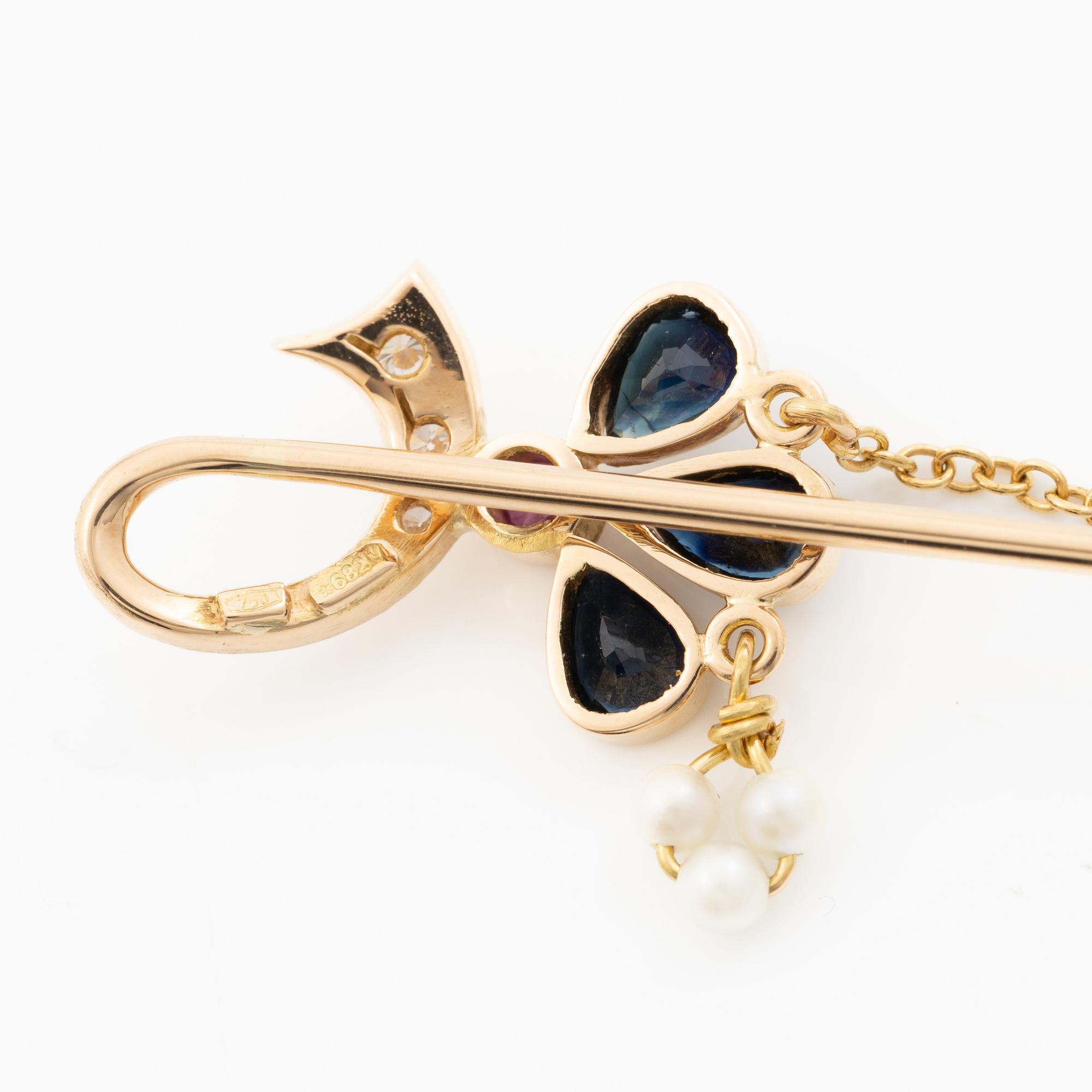 Lapel pin, 18K gold with brilliant-cut diamonds, sapphires, a ruby and pearls.