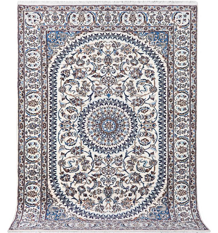 A Nain carpet, part silk, c. 291 x 201 cm.