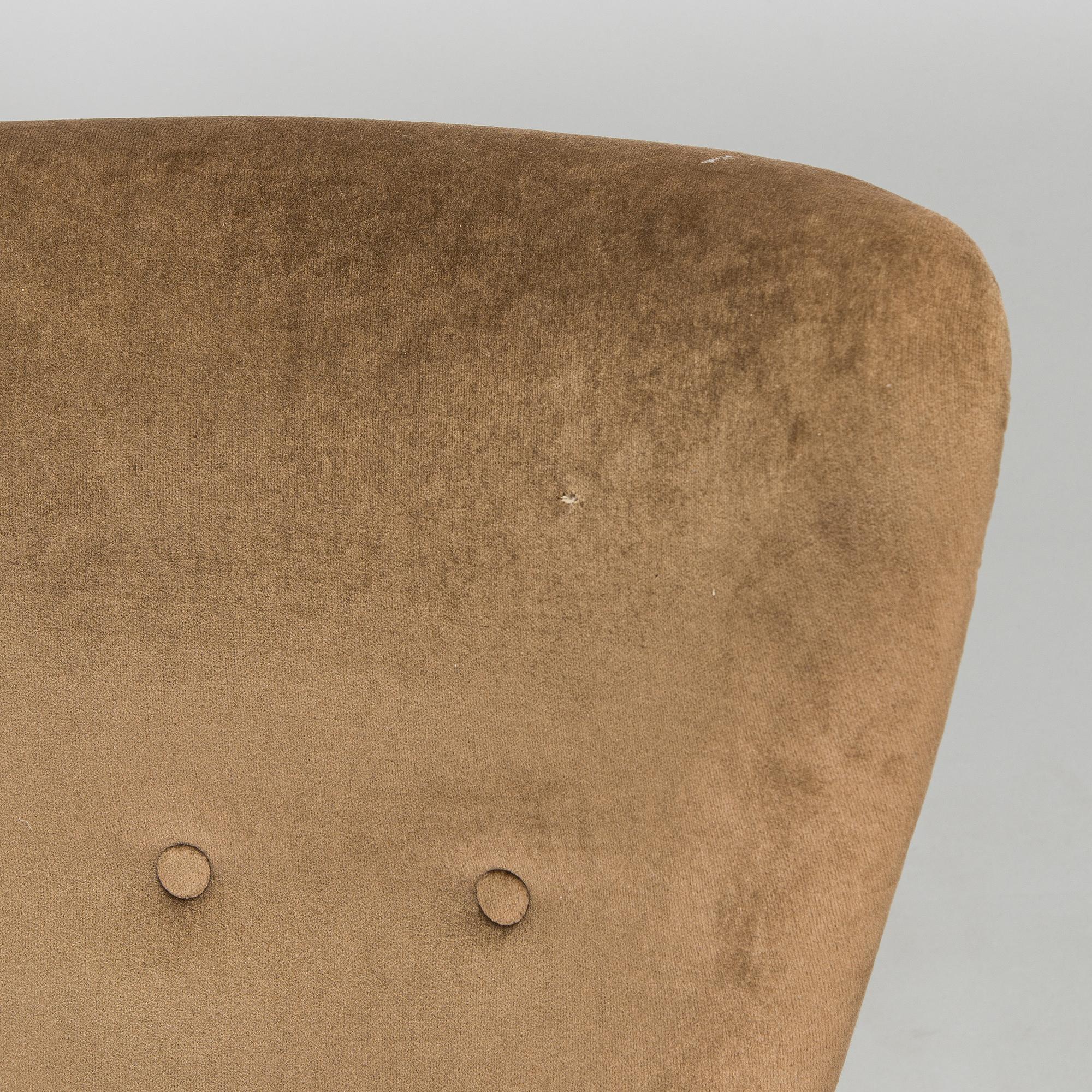 A pair of mid-20th century armchairs.