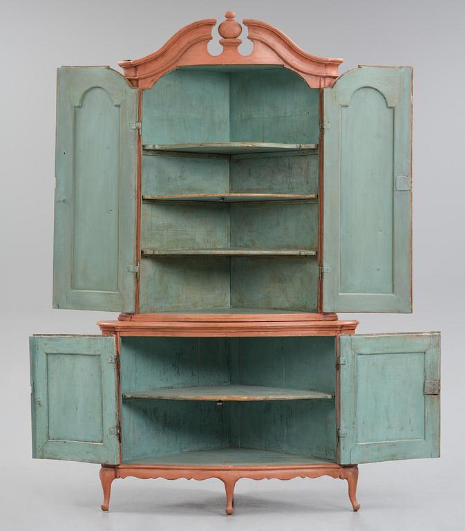 A rococo corner cabinet, later part 18th century.