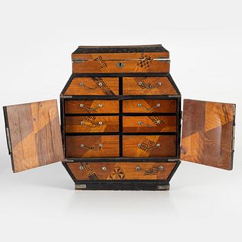 A Japanese miniature chest, early 20th Century.