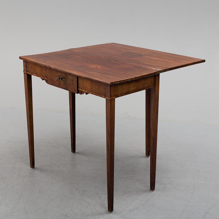 An early 19th century mahogany card table.