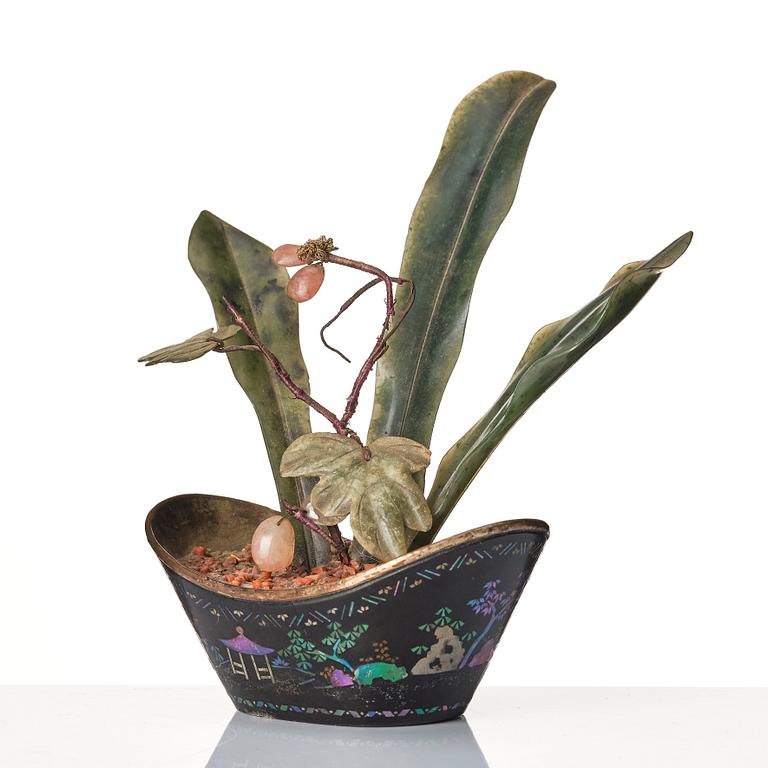 A Chinese miniature 'hard stone' flower arrangement in a ingot shaped lac burgauté pot, Qing dynasty, 18th century.